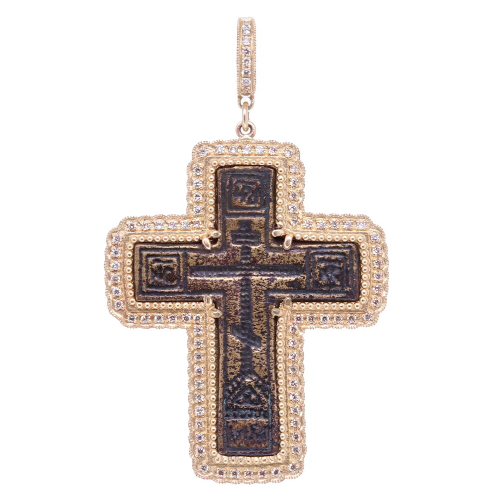 This antique “Old Believers” Cross is defined by it’s straight lines and no curves. The crosses typically have the eight-point cross in the center surrounded by delicate designs. The Orthodox “Old Believers” were an Orthodox sect that broke
from the official Russian Orthodox Church as a protest against church reforms; the schism took place in the 17th century. This original cross has been set into a solid 14k Yellow Gold bezel 13.68g with Diamonds 0.72 tcw.
Antique Old Believers Cross Pendant