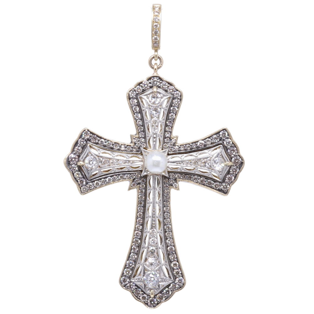 This original Art Deco Cross is from the 1930's. The Cross is solid platinum with mine cut diamonds 0.84 tcw featuring a beautiful pearl. Cynthia Ann transformed this cross by adding a bezel consisting of 14k yellow gold 6.28g, diamonds 1.77 tcw, and rhodium sterling. The total diamond weight including the old mine cut diamonds is 2.61 tcw. Antique Art Deco Diamond Cross Pendant