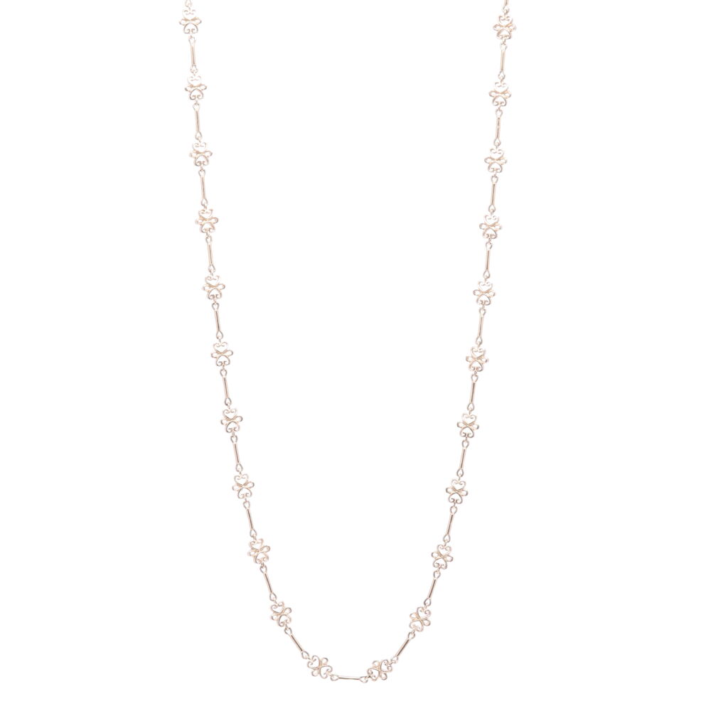 This 32" handmade chain has abstract scroll stations. The scroll stations are L- 6.57mm x W- 2.70mm x L- 10.53mm. The total 14k Yellow gold weight is 36.62g. Scroll Yellow Gold Link Chain 32"