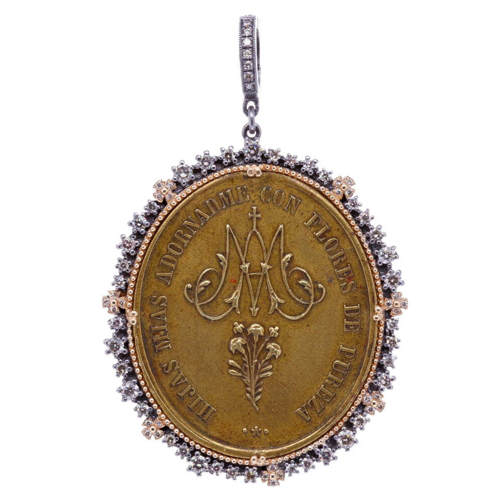 This Spanish Ave Maria bronze medal was made by a master craftsman. Ave Maria translates to "Hail Mary" in Latin. It's framed by a unique diamond bezel with seven Maltese crosses. The front is translated to "My daughters purify me with purity flowers". The back of this piece depicts Mary and is translated to "Put me as a seal on your Heart". This special Ave Maria pendant is set in 14k Yellow Gold 7.97g, Diamond 1.19tcw, and Rhodium Sterling bezel. Spanish Ave Maria Pendant