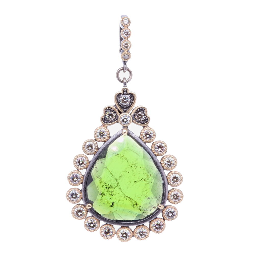 This gorgeous deep green tourmaline stone has been set inside a unique diamond bezel. The bale has a 4mm opening. Theres 1.60 carats of Diamonds, 14k Yellow Gold 6.52g, and rhodium sterling silver. Green Tourmaline Pendant