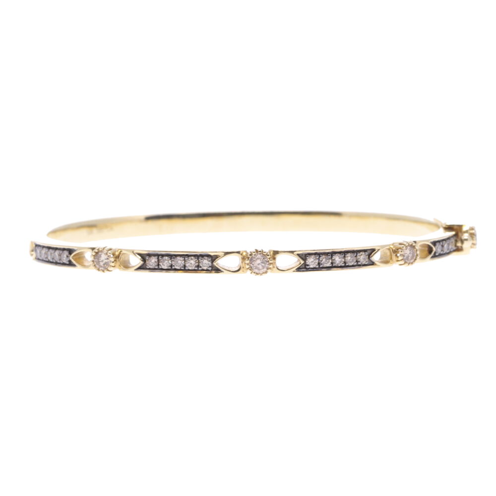 The Lizzie bracelet is handcrafted with 14k yellow gold 18.3g and champagne diamonds 0.70tcw. Lizzie Diamond Hinged Bracelet