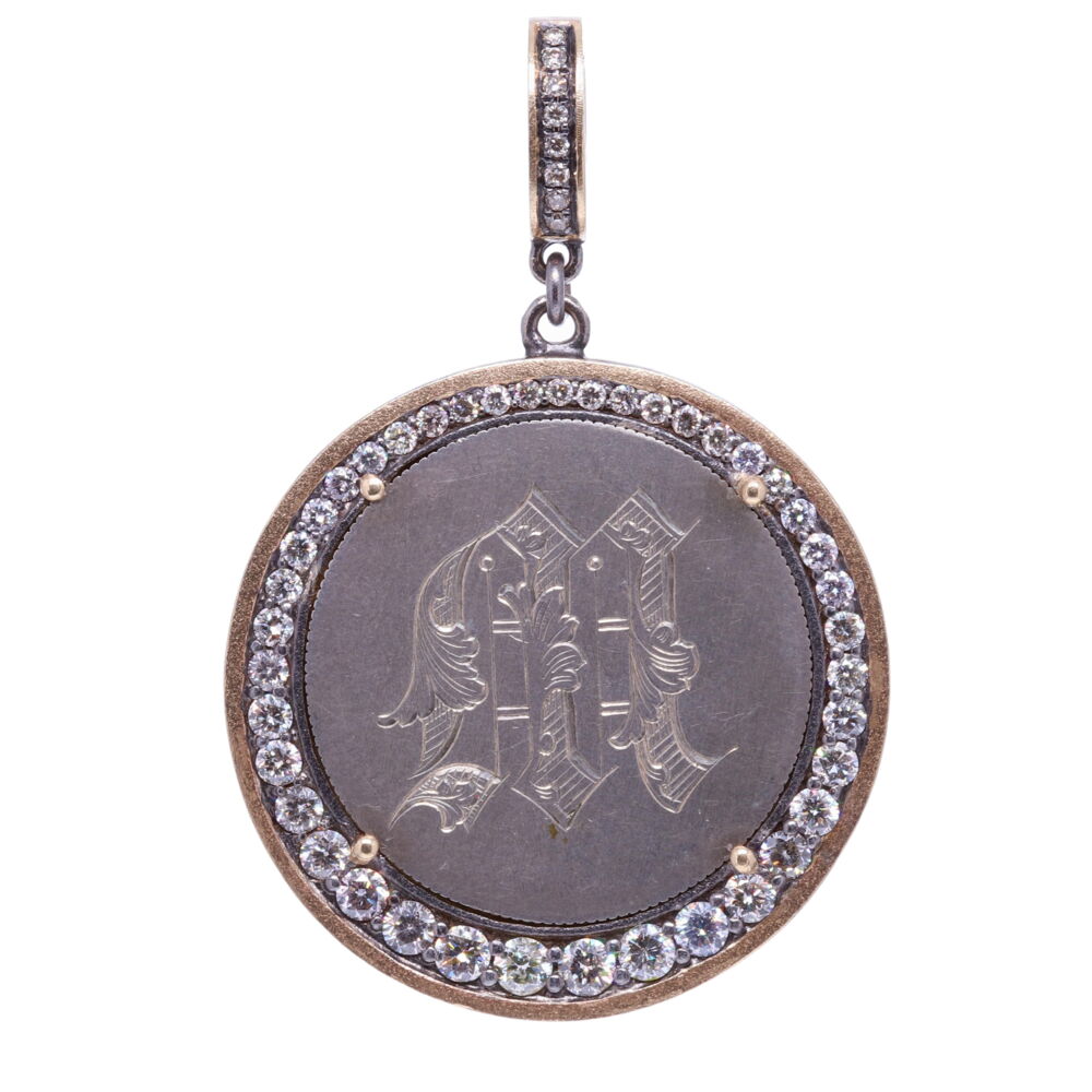 Love tokens reached their peak popularity during the Victorian era but are believed to have originated somewhere in Great Britain during the 1500’s. Often Love Tokens were exchanged between sweethearts as “tokens of love” or even marriage proposals. Love Tokens are generally defined as monetary coins from which one side (or sometimes both sides) have been smoothed down flat and engraved with names, phrases, monograms, and sometimes even pictorials.
Love Token Engraved With "M"