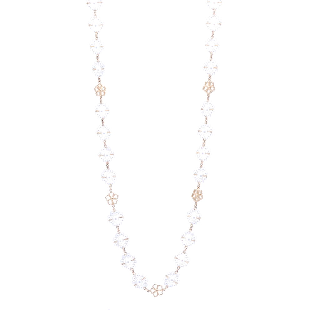 This Limited Edition Akoya pearl necklace is strung with 360, 3 mm mirror like pearls which are defined by their white hue. 14k Yellow Gold is strung in between each pearl and handmade flower stations are displayed throughout the necklace. It's complete with a gold clasp that opens up to 7mm. The total gold weight is 19.00g. Limited Edition Akoya Pearl Flower Necklace 27"