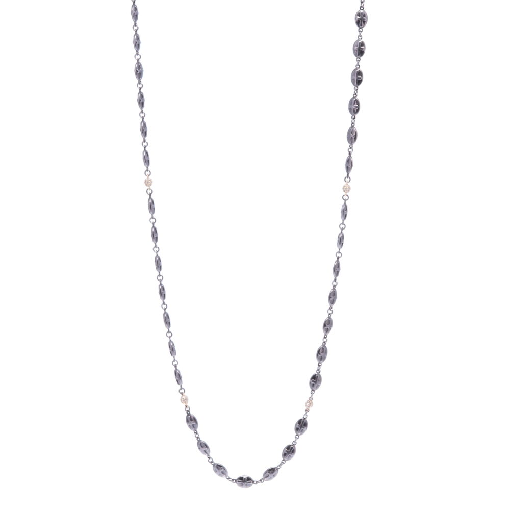 This handcrafted 30" Rhodium Sterling high polish chain has oval shaped shields with a cross engraved on each side. The eight 14k Yellow Gold 3.51g and Diamond 0.72 tcw spheres are placed throughout the chain adding sparkle. This chain can be worn in reverse, hanging your pendant(s) on the jump ring and clasp. The clasp can be upgraded to a diamond clasp (contact for details). Polished Cross Shield Chain With Yellow Gold Diamond Stations 30"