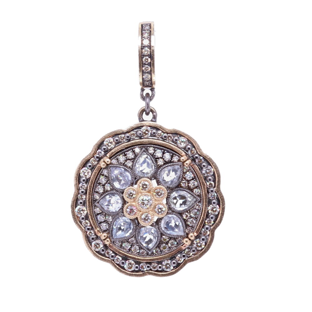 This white sapphire and diamond pendant resembles a flower bloom. The bezel consists of 14k Yellow Gold 8.54g, Diamonds 1.10 tcw, rose cut white sapphires, and rhodium sterling silver. The bale has a 4mm opening. White Sapphire Bloom Pendant