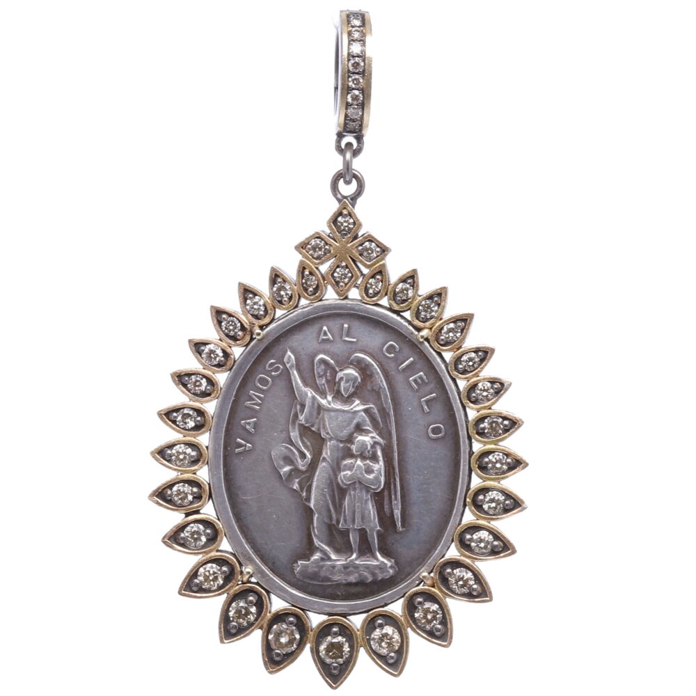 This Spanish Guardian Angel has a powerful message on the front which translates to "We go to Heaven" and the back "There is our model". Belief in Guardian Angels can be traced throughout all antiquity. This Spanish medal represents your Guardian Angel that has been with you since you took your first breath and will be with you when you pass out of your body and return to the spiritual realms. This angel is unique to you and is there to guide you through your “spiritual journey” here on earth. She is a reminder of your faith in God and that you are never alone. This Spanish medal is set inside a Cynthia Ann 14k yellow gold 4.66g, champagne diamond 0.90tcw, and rhodium sterling bezel. Spanish Silver Guardian Angel Pendant