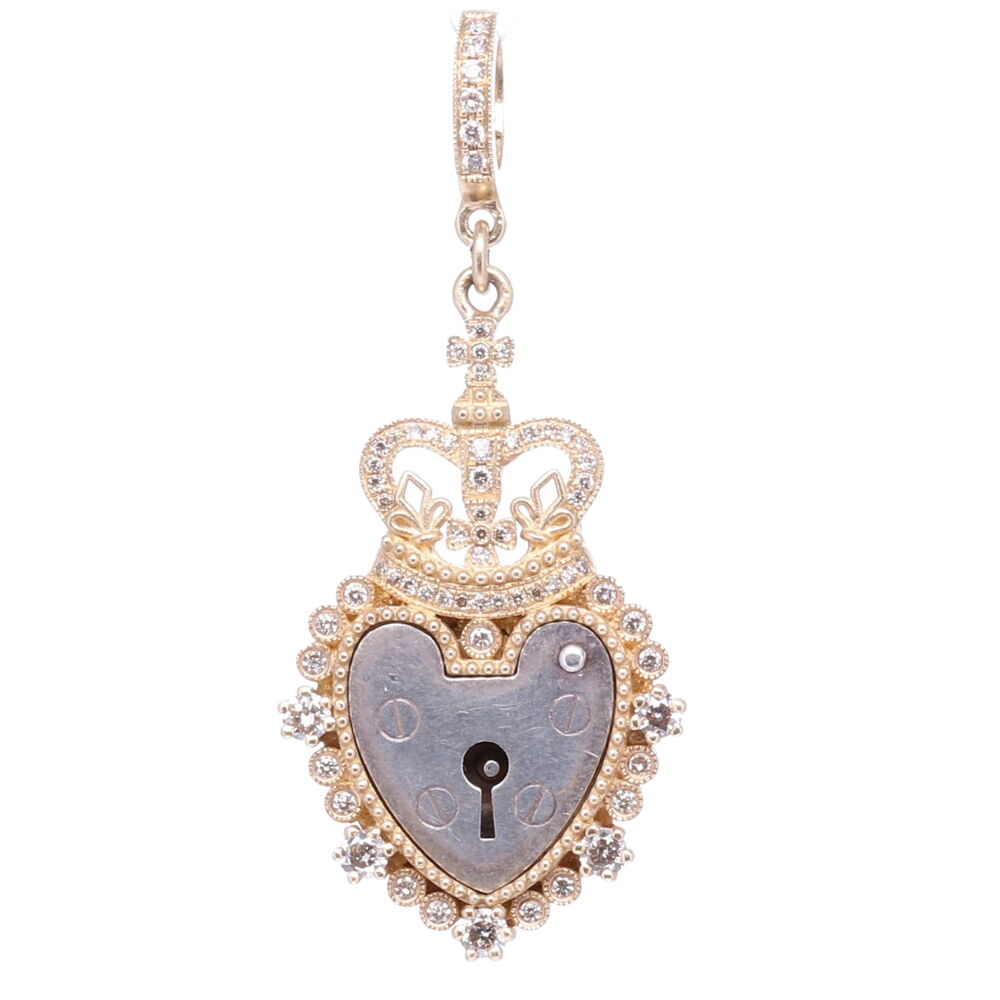 The Antique English padlock was typically worn on a bracelet and given to a loved one to show how much they were loved. Before going off to war, gentlemen would leave the bracelet locked around his loved one’s wrist and he would hold the key until his return. The heart shaped padlock was fashionable in the Victorian and Edwardian periods. Cynthia Ann designed a Crown bezel symbolizing the reward in heaven (the crown) coming after the trials in this life (the cross). The bezel is handcrafted from solid 14k yellow gold 8g and champagne diamonds 0.50 tcw. Antique Padlock Heart with Crown Pendant