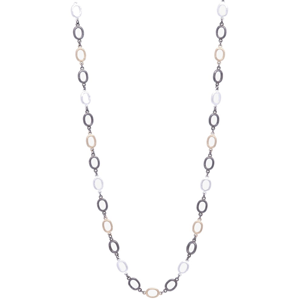 This classic 38" oval link chain is handcrafted in 14k Yellow Gold and Rhodium Sterling. The oval links have a signature satin finish and are three colors; 14k yellow gold, rhodium sterling, and sterling. The clasp has a 7mm opening and can be clipped onto any oval link to make it shorter or into a Y-necklace. This chain can be worn in reverse, hanging your pendant(s) on the jump ring and clasp. The clasp can be upgraded to a diamond clasp (contact for details). Satin Finish Tri Color Oval Link Chain 38"