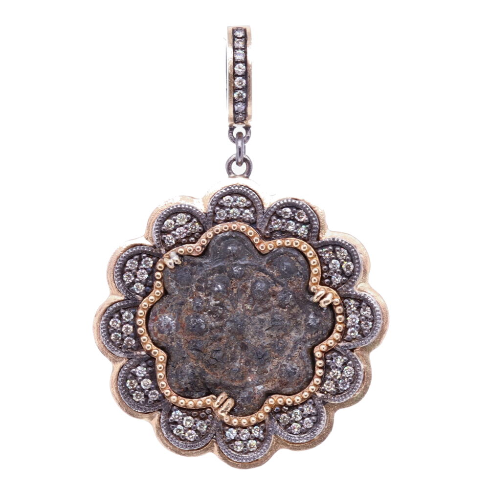 This 15-16th Century flower shaped artifact is original. It's framed by a unique scalloped bezel to mimic the artifact. The bezel has 0.45 carats of Diamond and 5.37g 14k Yellow Gold and rhodium sterling silver. The bale has a 4mm opening so it can be clipped onto different necklaces. 15-16th C. Flower shaped Artifact Pendant