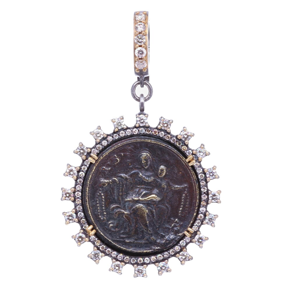 This original St. Vincent medal has oxidized overtime, turning this faint brown color. St. Vincent is the Patron Saint of charitable societies. He is recognized for his charity and compassion for the poor, through he is also known for his reform of the clergy and for his role in opposing Jansenism. He was a French Catholic priest who dedicated his life to serving the poor. This 16th Century French St. Vincent medal has been set inside a Diamond 1.06 tcw and 14k Yellow Gold bezel 2.39g. The bale has a 4mm opening. 16th C. St. Vincent Pendant