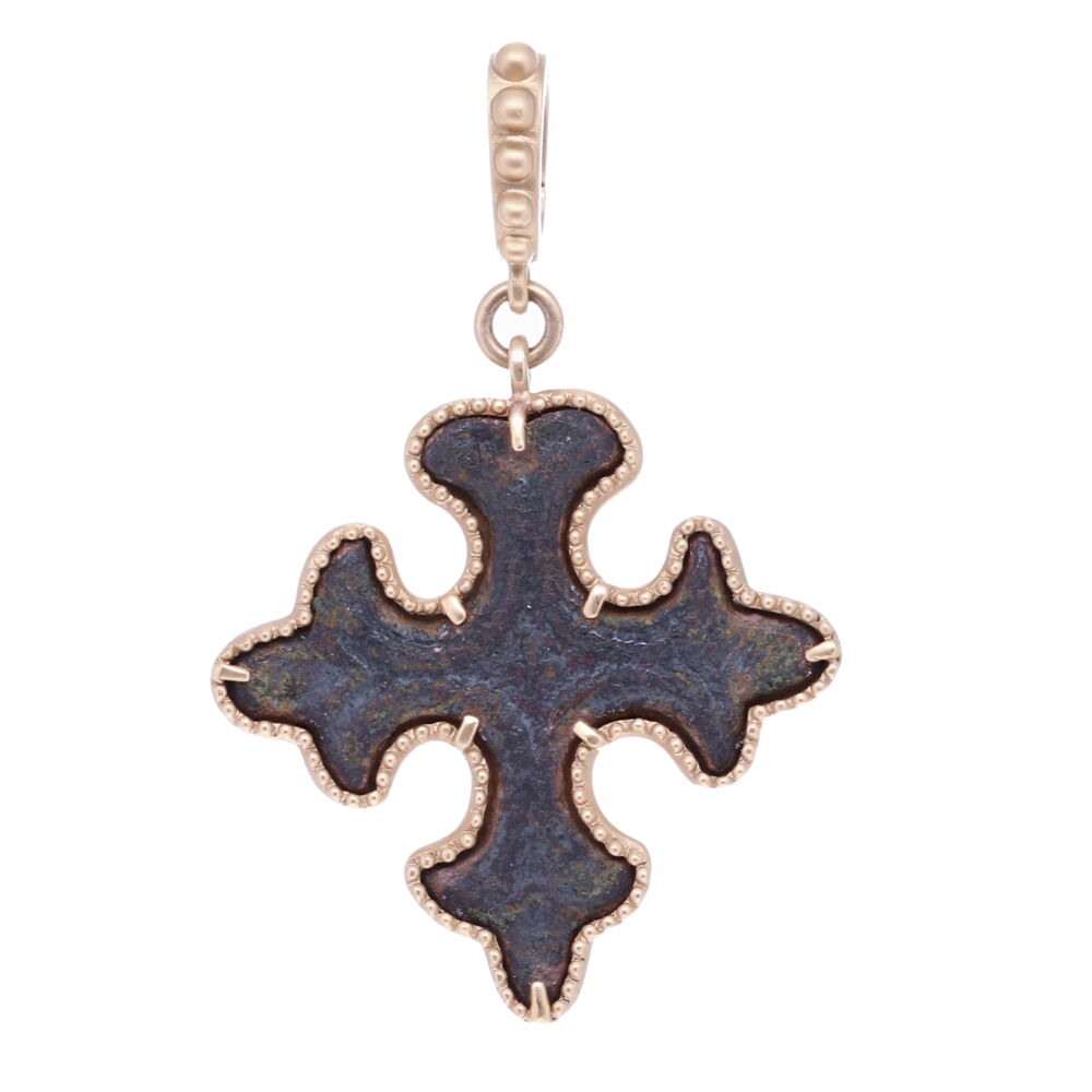Wearing a cross offers the wearer protection from evil. This artifact has decorative hand-carved details on the front. It was made to be worn on one side only. The center of the Cross has a smaller cross that can be seen if you hold the piece on an angle. This ancient cross has been set inside a unique 14k Yellow gold 8.4g bezel. The bale has a 4mm opening. Ancient Maltese Cross Pendant