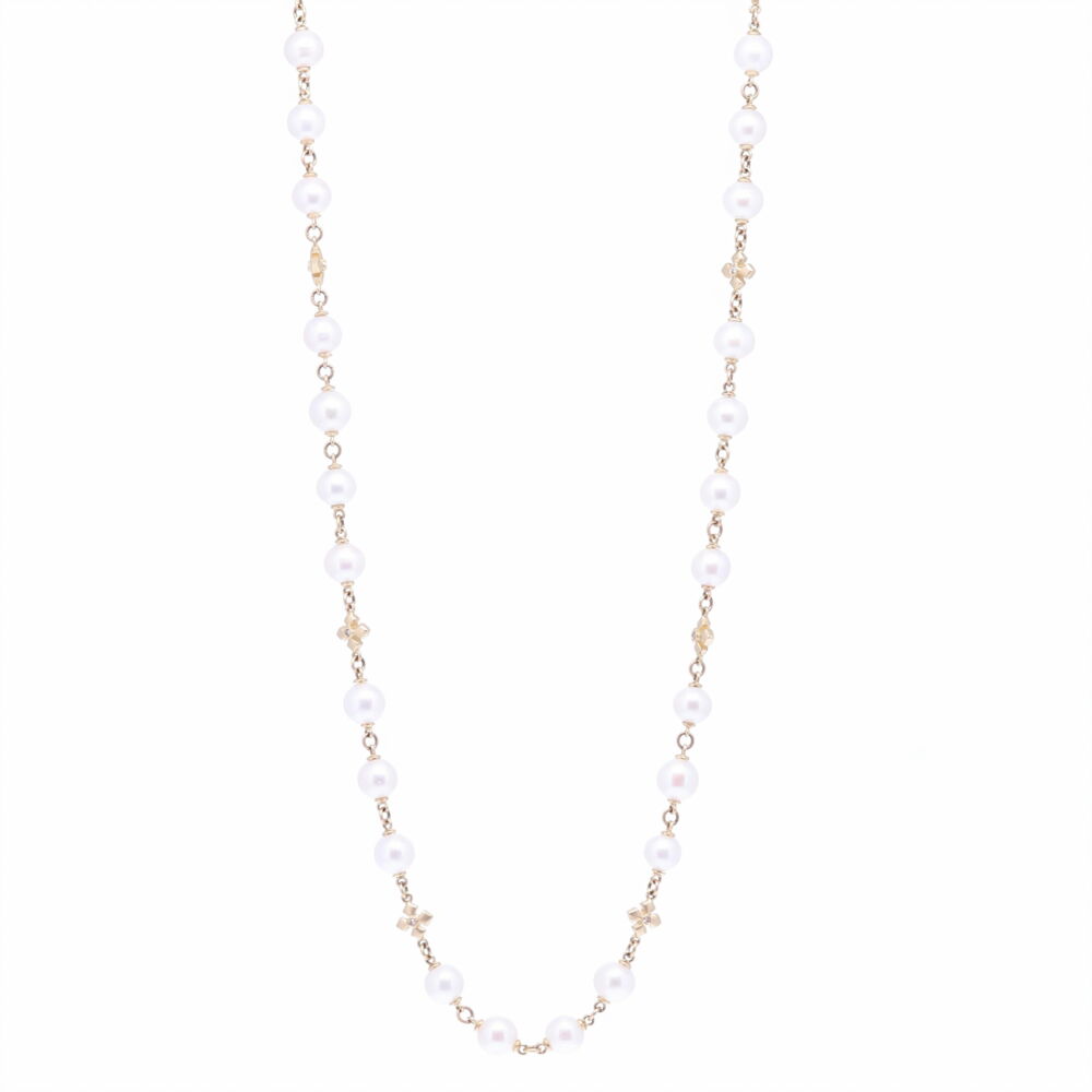 This Limited Edition Akoya Pearl necklace is strung with 46, 8.5mm mirror like pearls. Every three or four pearls there's a handmade solid 14k cross station with a diamond (12 total cross stations). The clasp is 14k gold. This 36" necklace may be doubled comfortably or worn long. The total diamond weight is 0.40 tcw, and 14k Yellow Gold 29.90g. Limited Edition Akoya Pearl Necklace With Cross Stations 36"