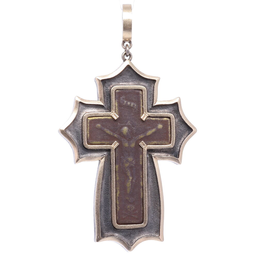 This ancient “Old Believers” Male Cross is defined by it’s straight lines and no curves. Old Believer crosses typically have the eight-point cross in the center surrounded by delicate designs. The Orthodox “Old Believers” were an Orthodox sect that broke from the official Russian Orthodox Church as a protest against church reforms; the schism took place in the 17th century. This original artifact is set in a 14k Yellow gold 6.91g and rhodium sterling bezel. The bale when opened is 4mm. Old Believer Male Cross Pendant