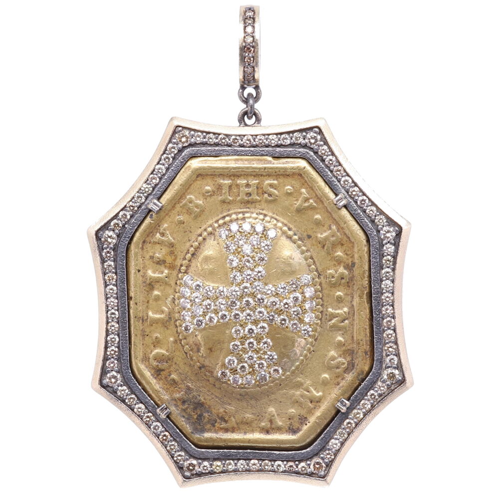 There is indeed no medal which possess such a wonderful power and protection from evil. The large CSPB on the front stands for "The Cross of our Holy Father Benedict". May the Holy Cross be the light, let not the dragon be the guide. V R S N S M V - S M Q L I V B on the front translates to "Begone Satan! Never tempt me with your vanities! What you offer me is evil. Drink the poison yourself!" The back of the pendant St. Benedict is holding a cross in his right hand (his devotion) and his left hand is his rule for monasteries. The original medal is set in a 14k Yellow Gold 6.4g, Diamond 2.05 tcw, and Rhodium sterling bezel. St. Benedict Diamond Cross Pendant