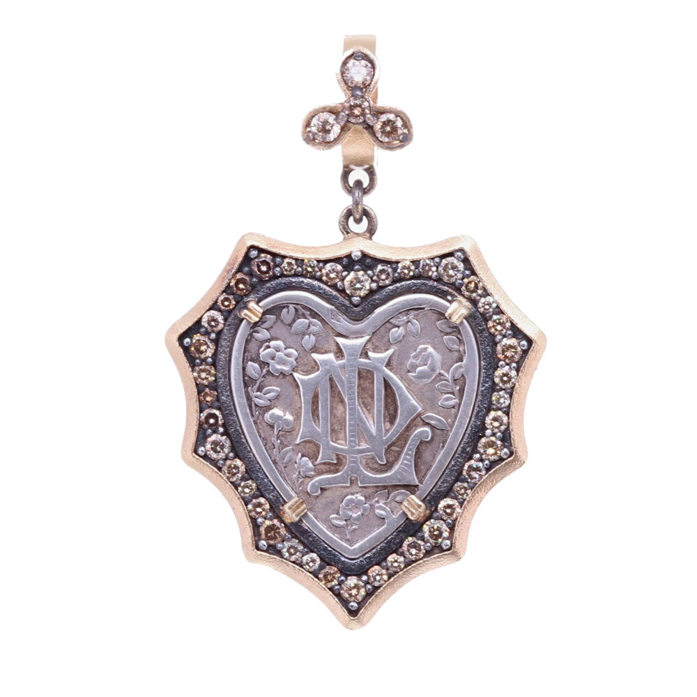 This beautiful French Notre Dame medal is set in a Diamond 0.94 tcw, 14k gold 4.10g, and Rhodium sterling bezel. The front of the medal displays a Mariner's cross which resembles an anchor, it symbolizes a 'Fresh Start' or 'Hope'. The roses symbolize Mary and the "Miracle of the Roses". French Notre Dame Heart Pendant