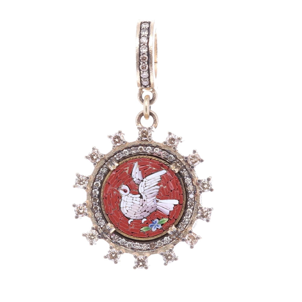 The original Italian micro mosaic was handcrafted in the mid 1800s. Surrounding the authentic micromosaic is a decorative 14k yellow gold 4.45g, rhodium sterling, and diamond 0.82tcw bezel. The deep maroon color emphasizes the white dove facing left. Doves symbolize the Holy Spirit and send us important messages from the Divine. A dove is a reminder that there is always hope and peace if you seek it. This can be worn as not only a pendant or a charm on a bracelet. Red *left facing* Italian Micro Mosaic Holy Spirit Dove Pendant