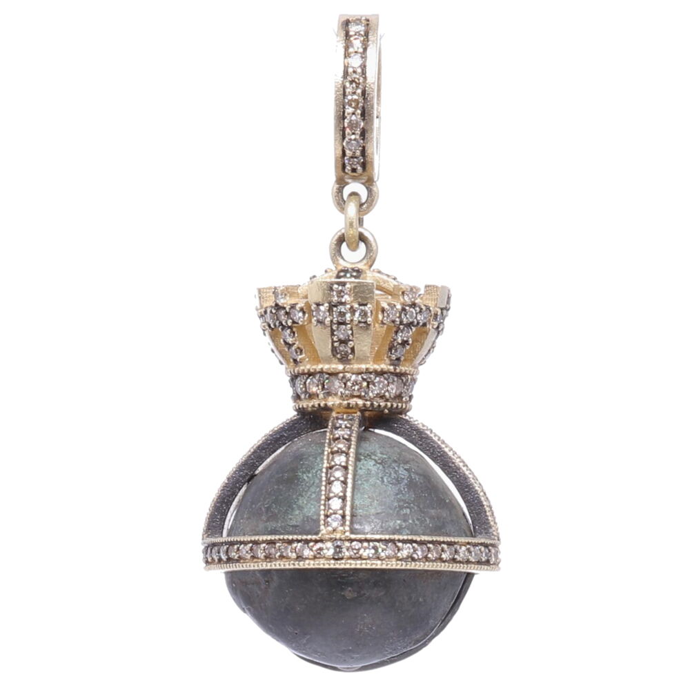 In Spain, during the 17th century, aristocratic toddlers were given religious sterling silver rattles to wear as a symbol of their Christian faith. They were made of several silver bells that represented church bells and worn around the waist, like a rosary. The church bells were also a reminder of the importance of worship and prayer. This bell has a natural green patina from oxidizing over time. Cynthia Ann designed a Crown bezel symbolizing the reward in heaven (the crown) coming after the trials in this life (the cross). It's set in a handmade rhodium sterling, 14k yellow gold 6.02g and diamond 0.85 tcw bezel. Small Antique Bronze Bell with Crown Pendant