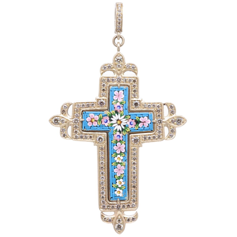 This antique turquoise micro mosaic cross is from the Grand Tour period in the mid to late 1800s. This spectacular piece is enhanced with a Cynthia Ann 14k yellow gold 18.46g, diamond 2.2 tcw, and rhodium sterling bezel. The turquoise tiles are arranged around the mosaic pink and white flowers. Our micro mosaics are our newest addition to the collection and truly a statement. Flowers and plants were created by God and they express divine goodness, truth, and beauty. Floral Turquoise Italian Micro Mosaic Grand Tour Cross Pendant