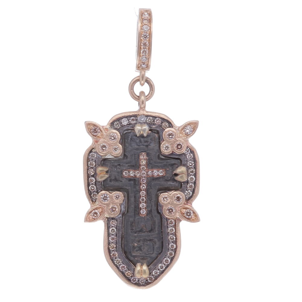 This antique “Old Believers” Cross is defined by it’s straight lines and no curves. The “Old Believers” were an Orthodox sect that broke from the official Russian Orthodox Church as a protest against church reforms; the schism took place in the 17th century. The original antiquity is set in a 14k yellow gold 4.98g and champagne diamond 0.57 tcw bezel. Cynthia Ann enhanced his medal with a diamond inlay Cross. Small Antique Old Believers Cross Pendant