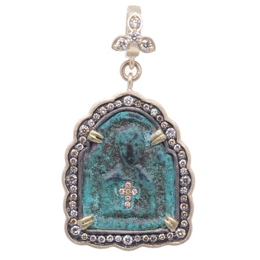 This spectacular 15th Century bronze medal is an original pendant Icon of Jesus. The antiquity originally had a bronze loop connected at the top to hang a cord. The medal has an interesting arch shape with green patina from oxidizing over time. This antiquity is set in a Cynthia Ann 14k yellow gold 4.11g, champagne diamond 1.00 tcw and rhodium sterling bezel. 15th Century Pendant Icon of Jesus