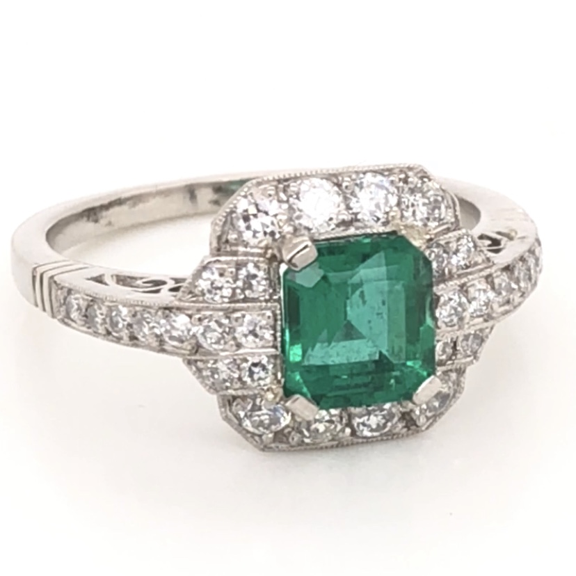 <div>This beautifully vintage ring, is featured in platinum, displaying Lab Reported Emerald, weighing a total of 1.06 carats. Filigree covers the underside of this setting as well as a halo of stunning diamonds, with a total weight of .60 carats. This vintage jewel is from the Art Deco era, and would make an excellent heirloom piece for any family, to be loved for centuries. </div> Platinum Art Deco GIA Lab Report Emerald & Diamond Ring