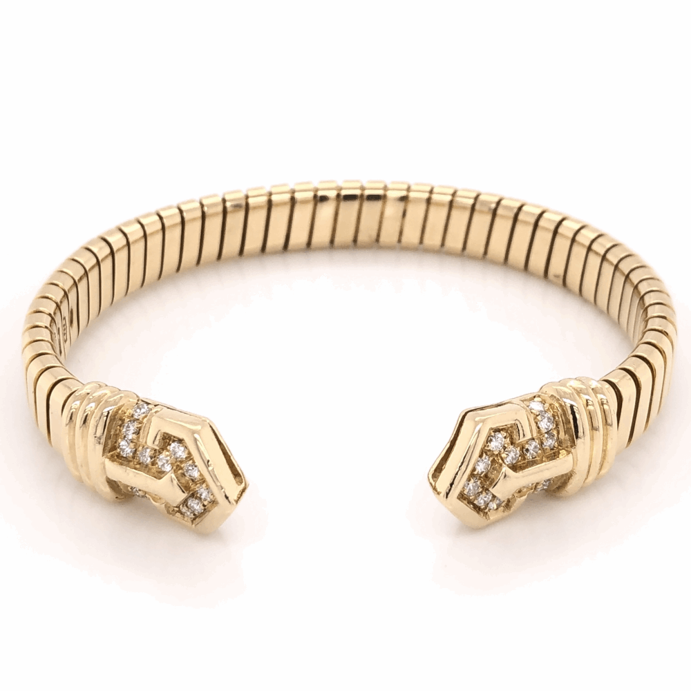 This is a true classic from Bvlgari and has it's iconic style. Don't miss this 1970's beauty! 18K Yellow Gold BVLGARI Diamond Open Cuff Bracelet .90tcw, 38.9g s6.5" c1970's