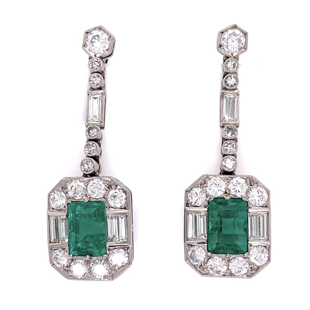 These classic Columbian F1 Emerald earrings are a true vintage set. Circa 1950's these earrings, set in platinum, display a total emerald carat weight of 4 carats, as well as 3 carats of diamonds. Making these earrings truly something fit for a queen. GIA certified : GIA# 5201367907
1950's Platinum Emerald & Diamond Earrings