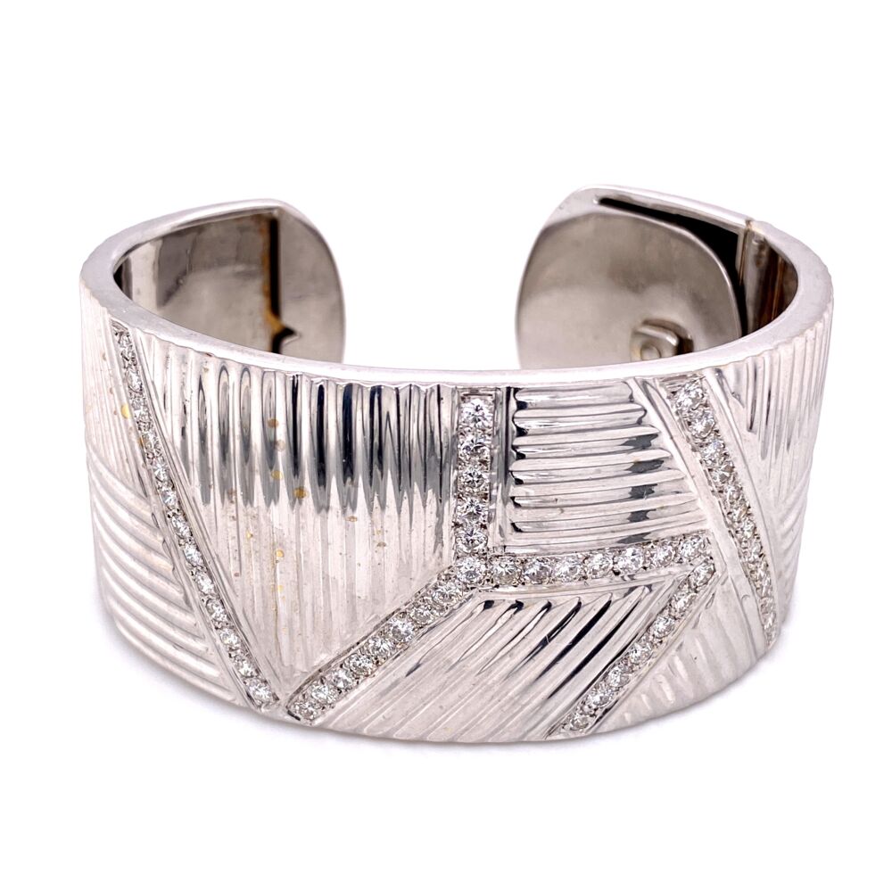 This chunky 14k white gold cuff bracelet, is a classic staple needed for any jewelry box. With a total carat weight of 3 carats and 1.25 Inches wide, this is a lovely piece you will enjoy for decades. Wide Diamond Cuff