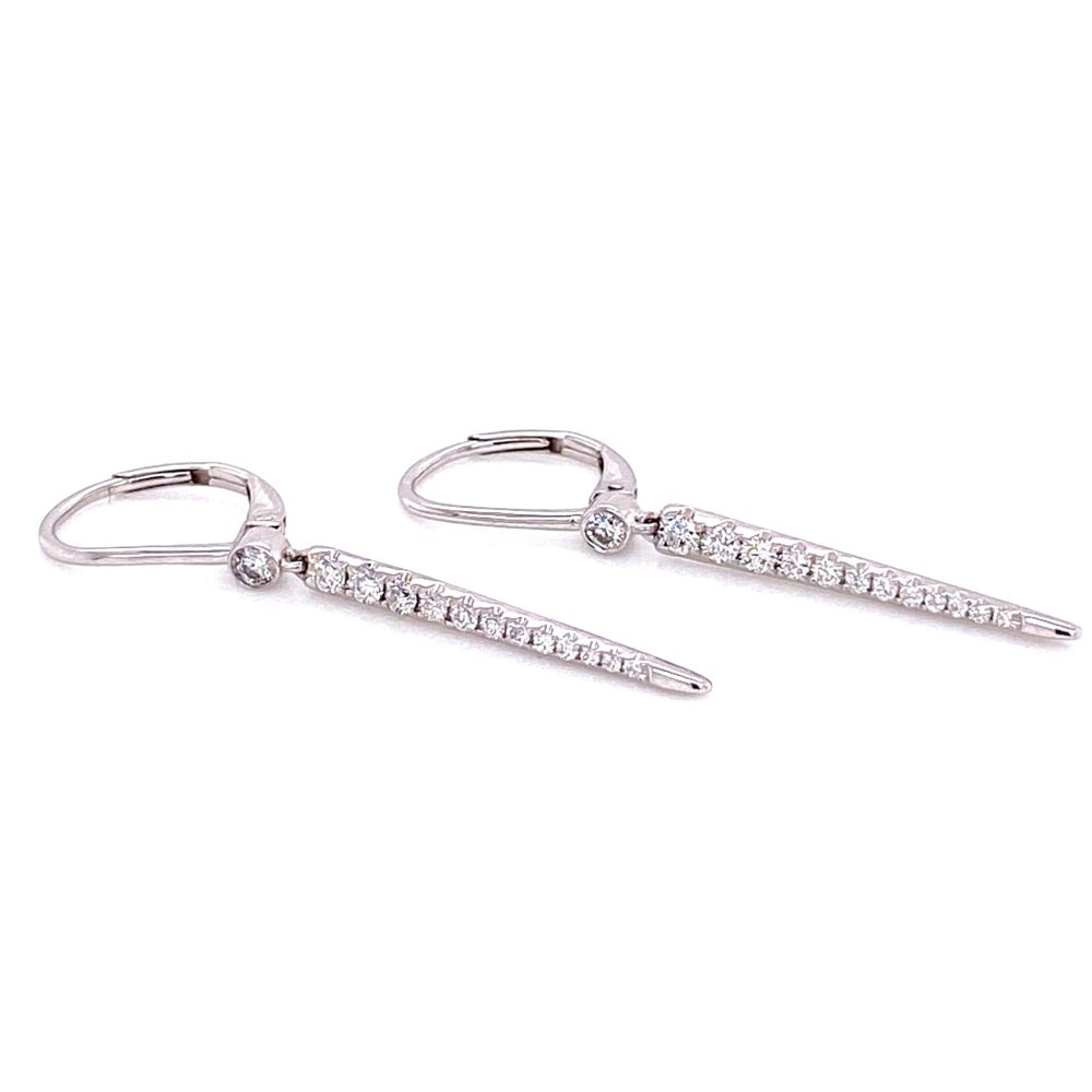 These 18k white gold spike earrings feature a diamond spike charm hanging down. Lightweight and super fun design, these earrings will be an everyday favorite. Long Diamond Spike Earrings