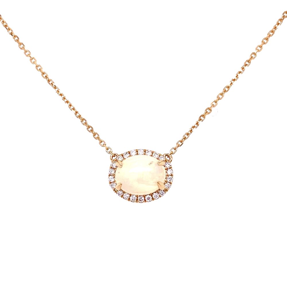 This stunning opal and diamond necklace is featured in 14k yellow gold. With a 1.75 total carat opal with a halo of .16 carats of diamonds this necklace will be an everyday favorite. Opal & Diamond Halo Necklace