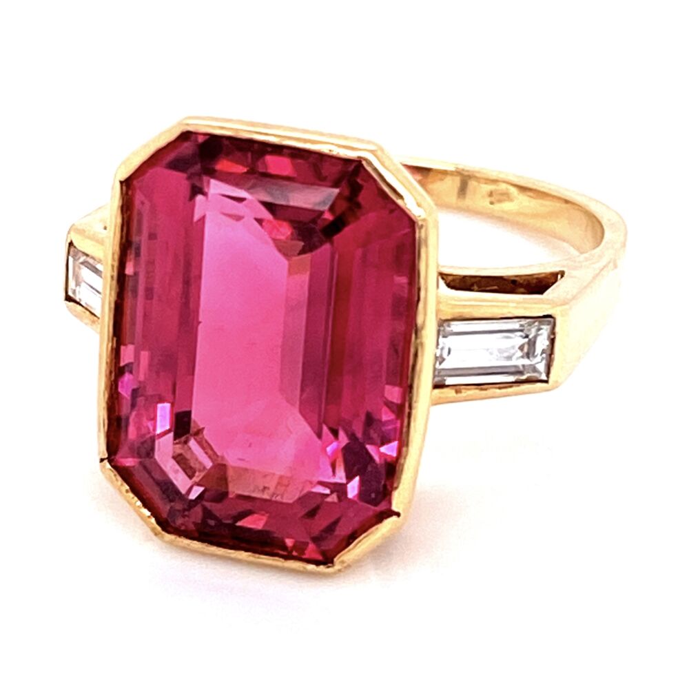 HOT PINK TOURMALINE... this color is no question a Rubelite... Wow! This custom made ring is very simple and classic, yet features the amazing emerald cut pink tourmaline in the center. It is flanked by matching baguettes and crafted in fine 18K yellow gold! 18K YG 10ct Pink Tourmalines Rubelite & .50tcw Diamond Ring 8.6g, s6.75