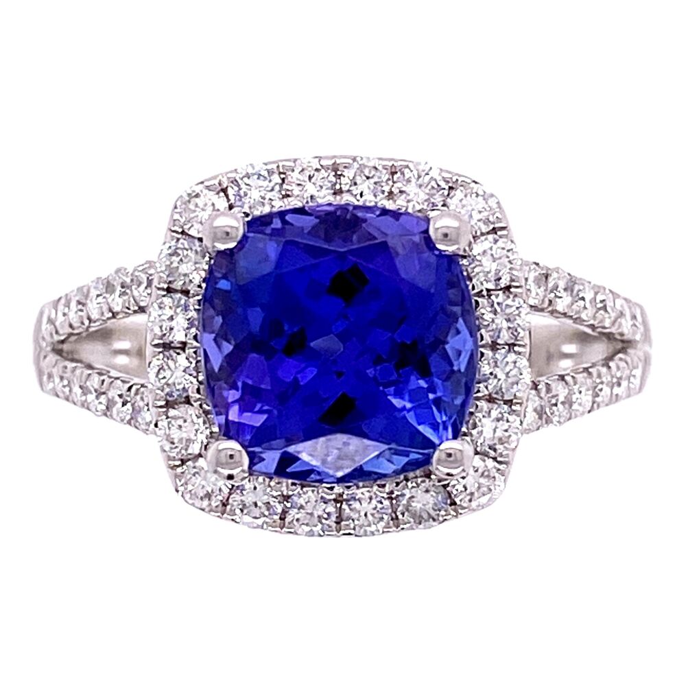 This ring is very made; the center is a very desirable, dark natural tanzanite weighing 1.68ct and spreading a look over 2ct and the pave diamonds are F color, VS clarity making this ring POP! 14K WG 1.68ct Cushion Tanzanite & .54ct Diamond Pave Ring 3.8g, s