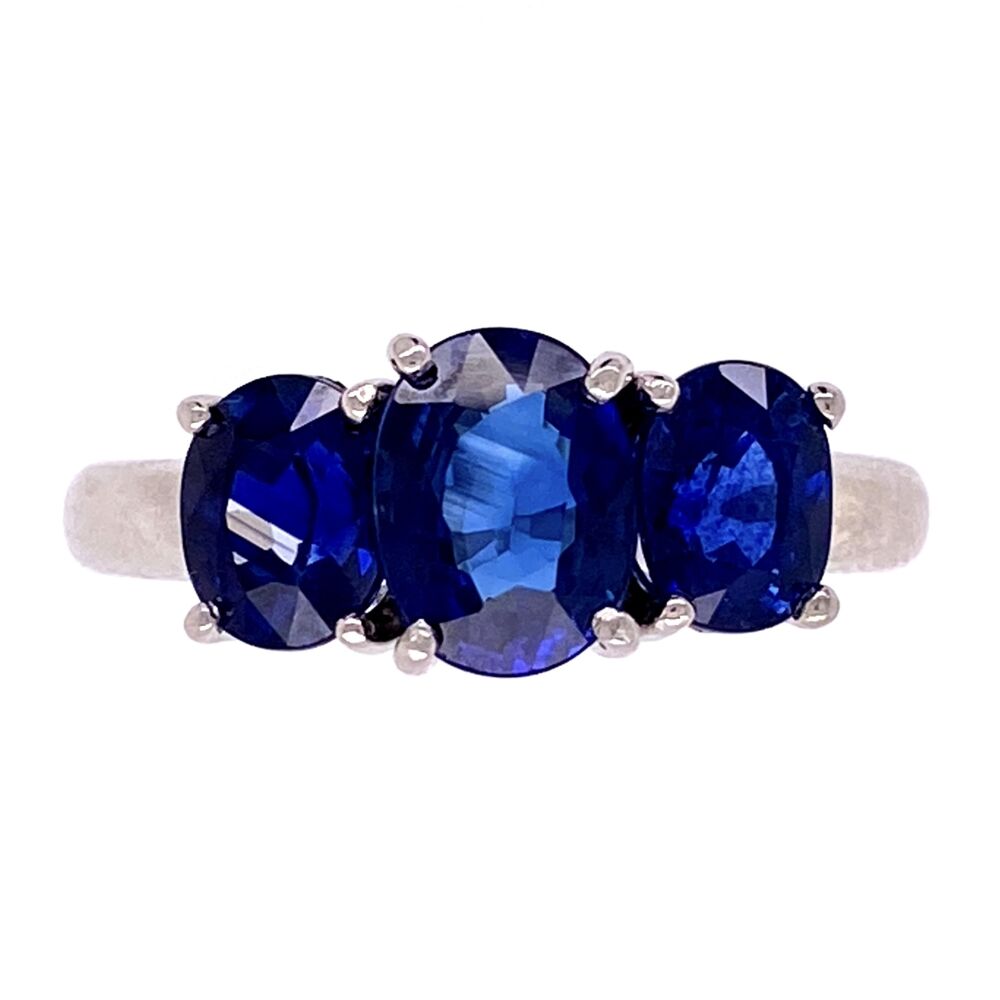 Classic & Beautiful, this three stone ring has perfectly matched natural oval blue sapphires weighing a known weight of 3.30tcw. The center measures to weigh about 1.5ct. The platinum heads the sapphires sit in were custom made for this ring and fit the stones like gloves with each having their own 4 prongs Platinum 3 Stone Oval Sapphire Ring 3.30tcw 6.4g, s5.25