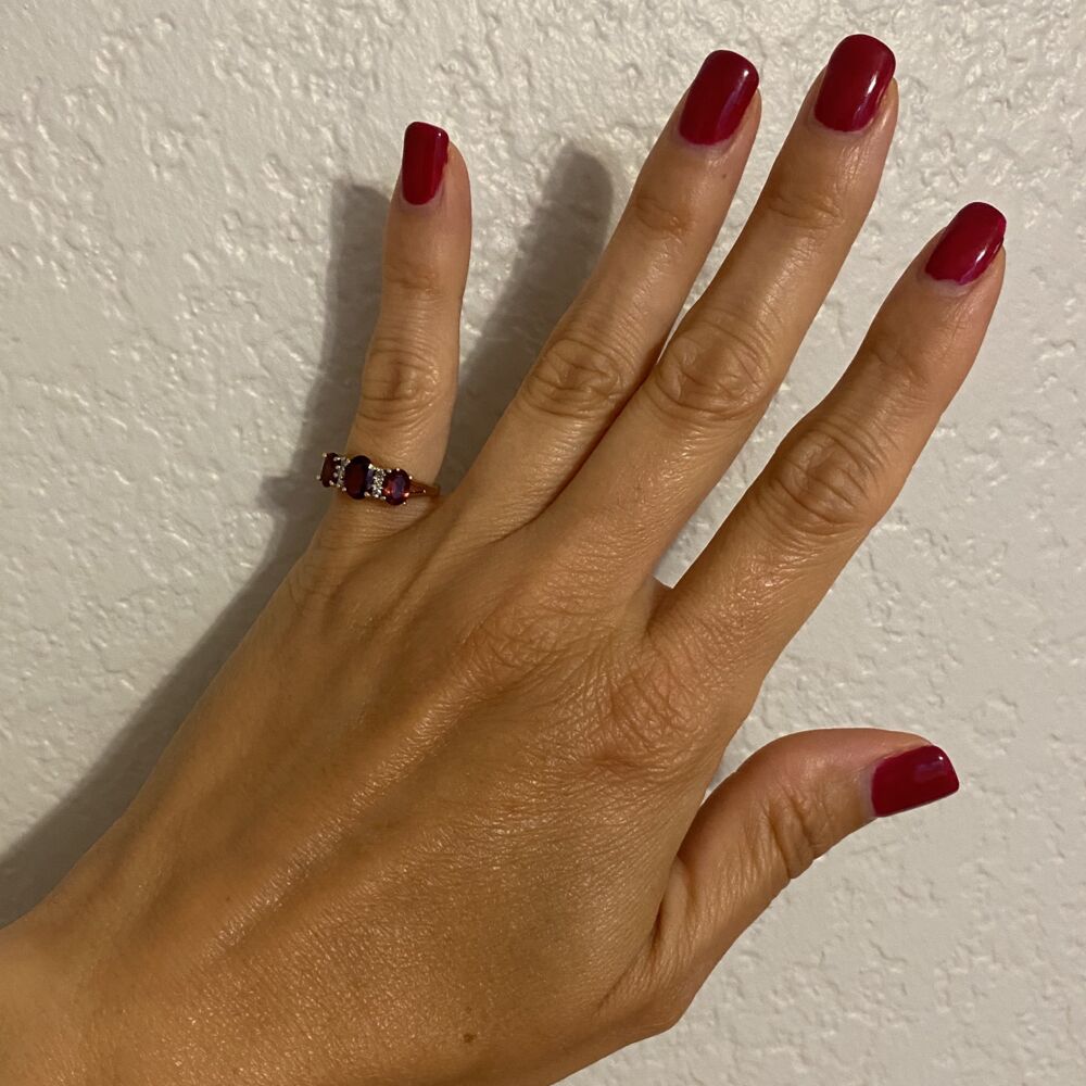 This ring is another great gift idea with 3 oval Garnet gemstones weighing approx. 1.10tcw & 6 side round brilliant diamonds weighing approx. .04tcw. The shank splits slightly after the gemstones before coming together about half way down 10K YG 3 Stone Garnet & Diamond Ring 3.3g