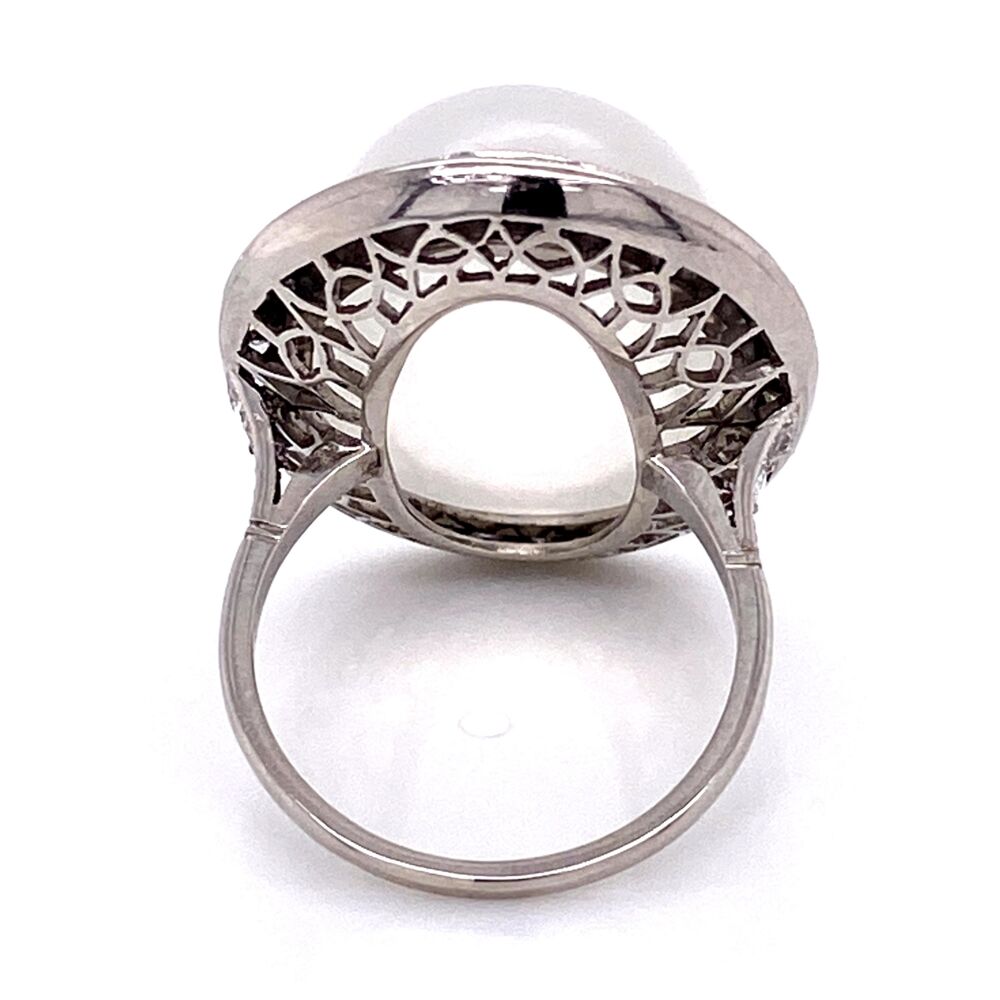 This hand made ring has a center oval cabochon moonstone weighing approx. 25cts. The moonstone is surrounded by rose cut diamonds weighing approx. .80tcw. Check out the amazing perfection of milgrain and handmade details! Platinum Handmade Large Moonstone Ring with Rosecut Diamonds