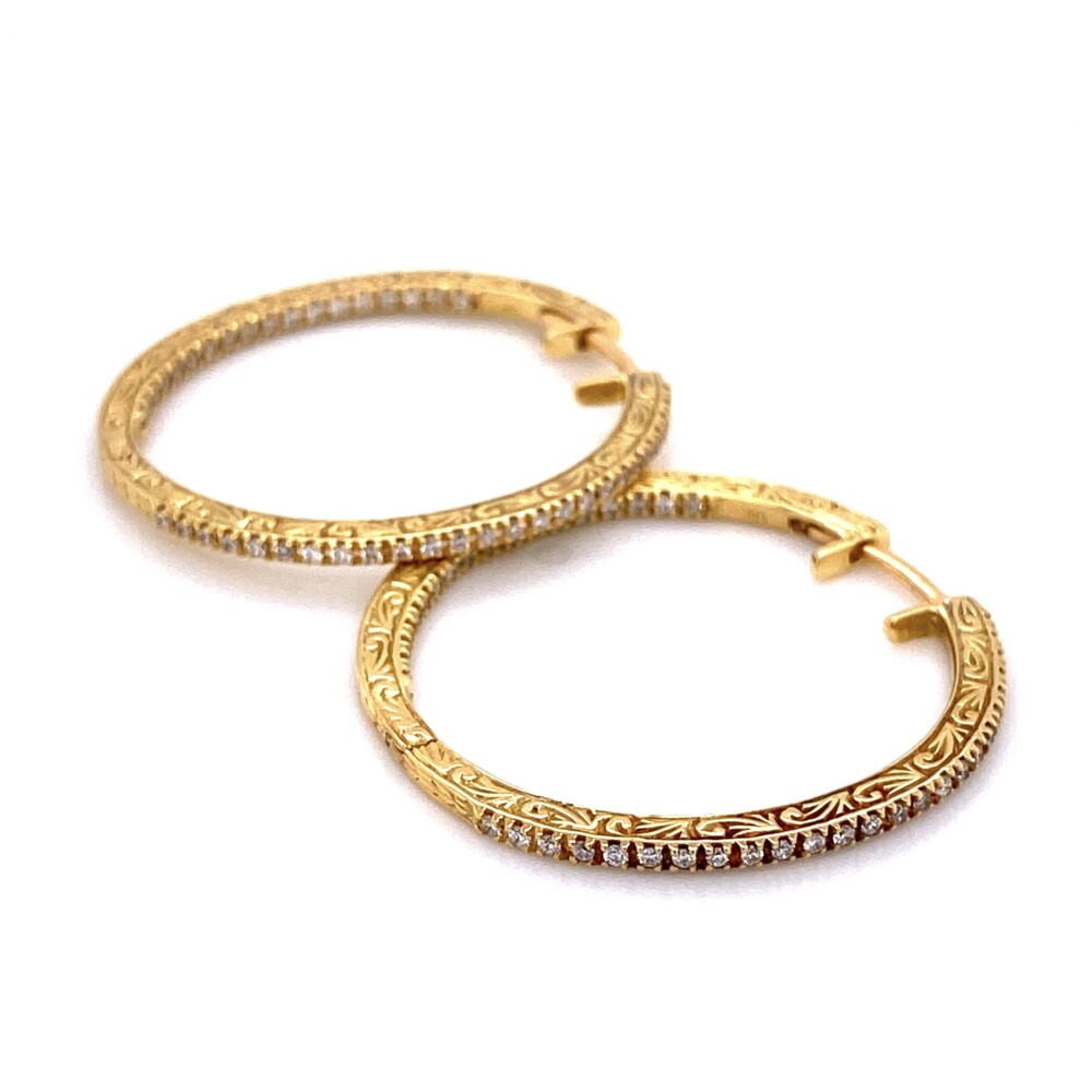 These Earrings have diamonds inside and out with amazing engraving on the sides. The round brilliant diamonds weigh about .84tcw and are G-VS quality. The last known list was $4050 18K Yellow Gold PENNY PREVILLE Diamond Hoops