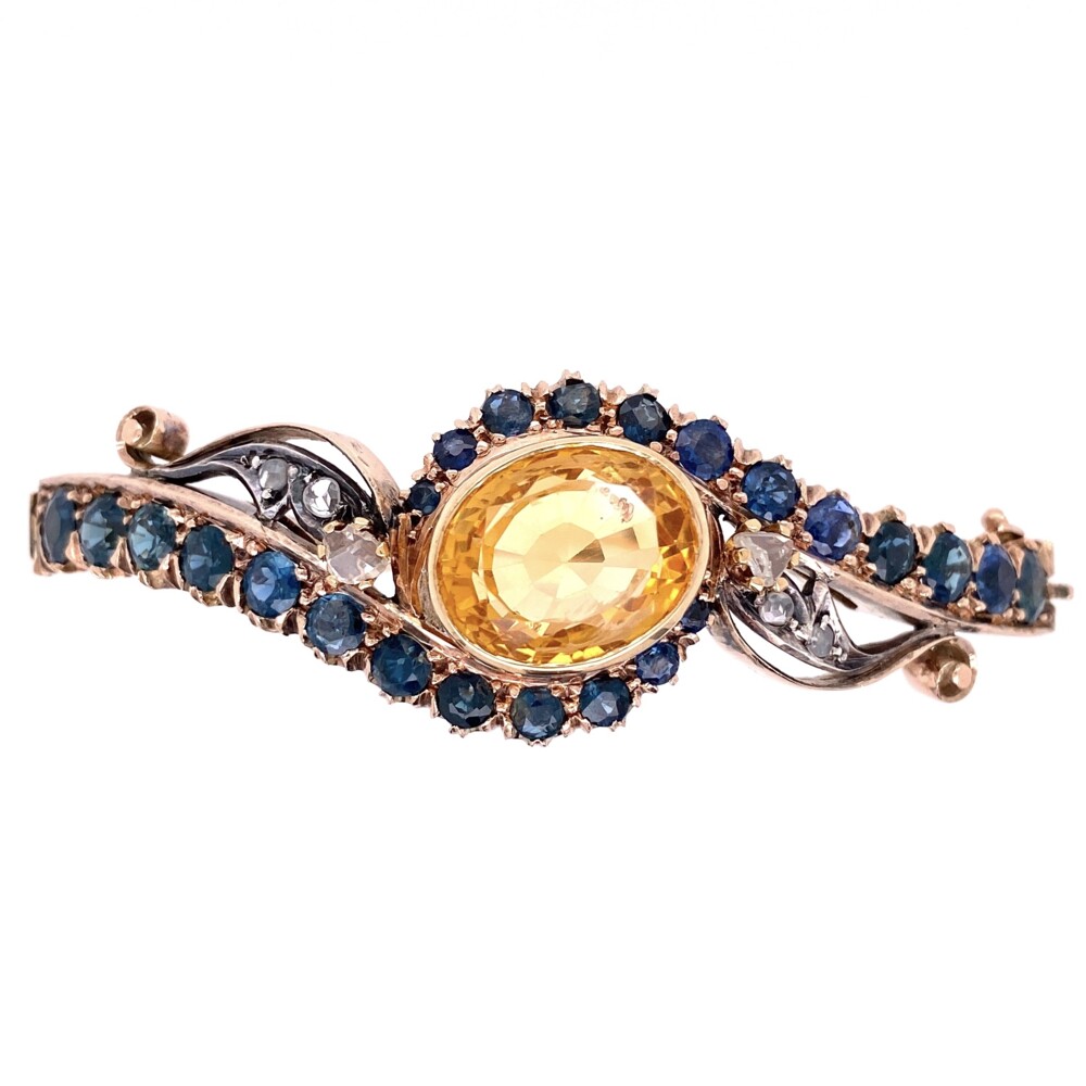 This beautiful bangle bracelet is from the late 1800's and have a center oval citrine weighing approx. 7cts. There are 24 total round blue sapphires in various shades approx. 4.30tcw & 6 rose cut natural diamonds approx. .20tcw.<div style="position: initial; margin: initial;"><span style="font-size: 16.8px; position: initial; margin: initial;"><a href="https://youtu.be/WC5F7SeRwcw" title="https://youtu.be/WC5F7SeRwcw" style="text-decoration: none;">https://youtu.be/WC5F7SeRwcw</a></span><br style="position: initial; margin: initial;"></div> 15K Victorian Bangle Bracelet with Sapphires, Citrine & Diamonds 22.1g