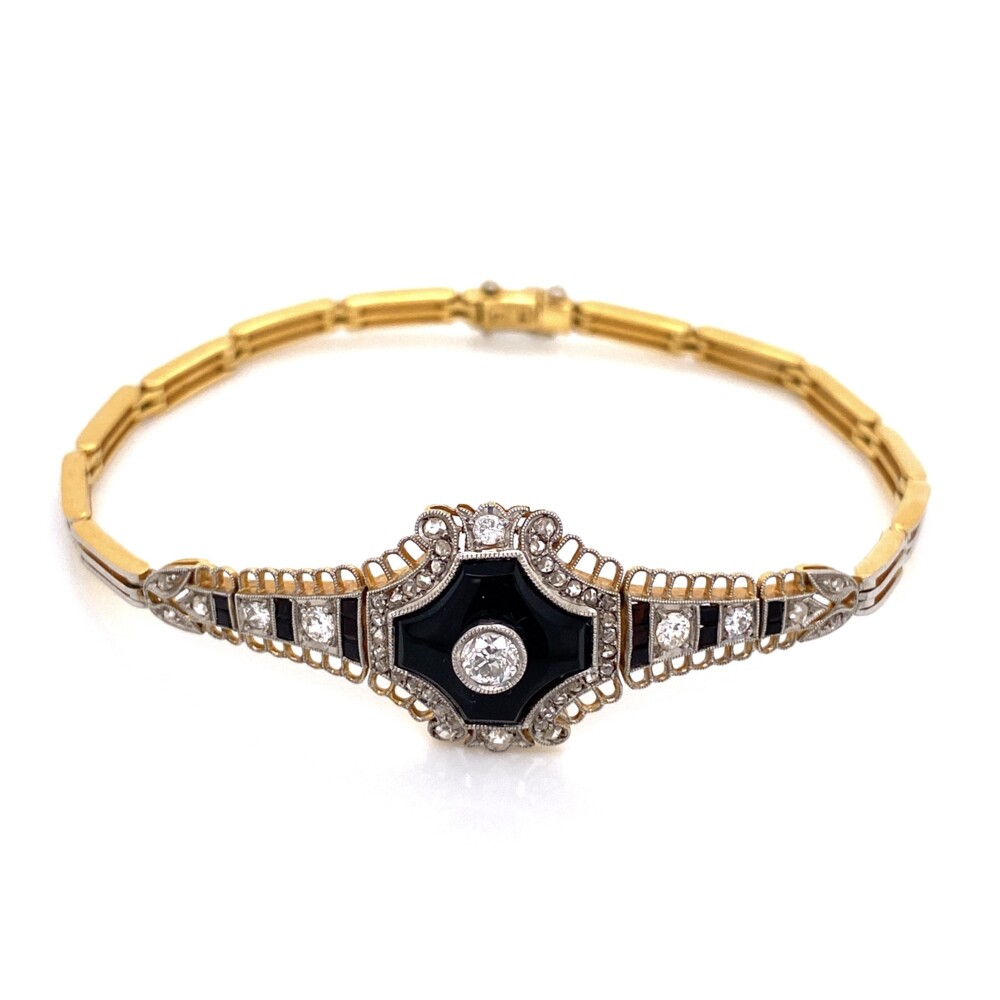 This amazing bracelet is hand made with Platinum on top of 18K yellow gold. The center old cut diamond weighs .15ct and is surrounded by a slab of polished black onyx, 4 old mine diamonds weigh .20tcw & 40 rose cut diamonds weigh .50tcw totaling diamond weight of .85tcw.<div style="position: initial; margin: initial;"><span style="font-size: 16.8px; position: initial; margin: initial;"><a href="https://youtu.be/ltezsJpS56Q" title="https://youtu.be/ltezsJpS56Q" style="text-decoration: none;">https://youtu.be/ltezsJpS56Q</a></span><br style="position: initial; margin: initial;"></div> Platinum on 18K Edwardian Onyx & Diamond Bracelet .85tcw, 13.1g, 7.5"