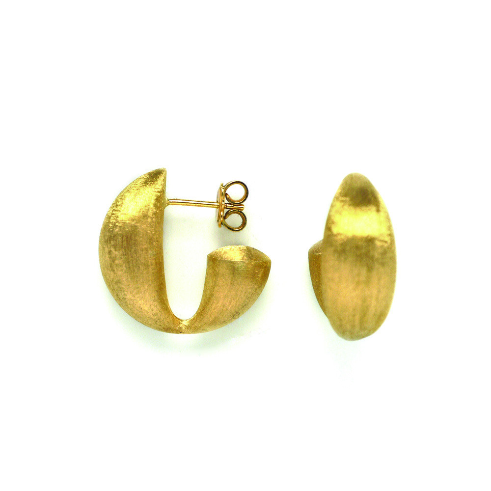 These truly alluring 18K yellow gold earrings brought to you by Nanis Fine Jewelry and Italian designer Laura Bicego bring style and sophistication. They feature a chunky style with a 3/4 stud hoop and a dramatic angle at the back. Transformista Hoop Earrings