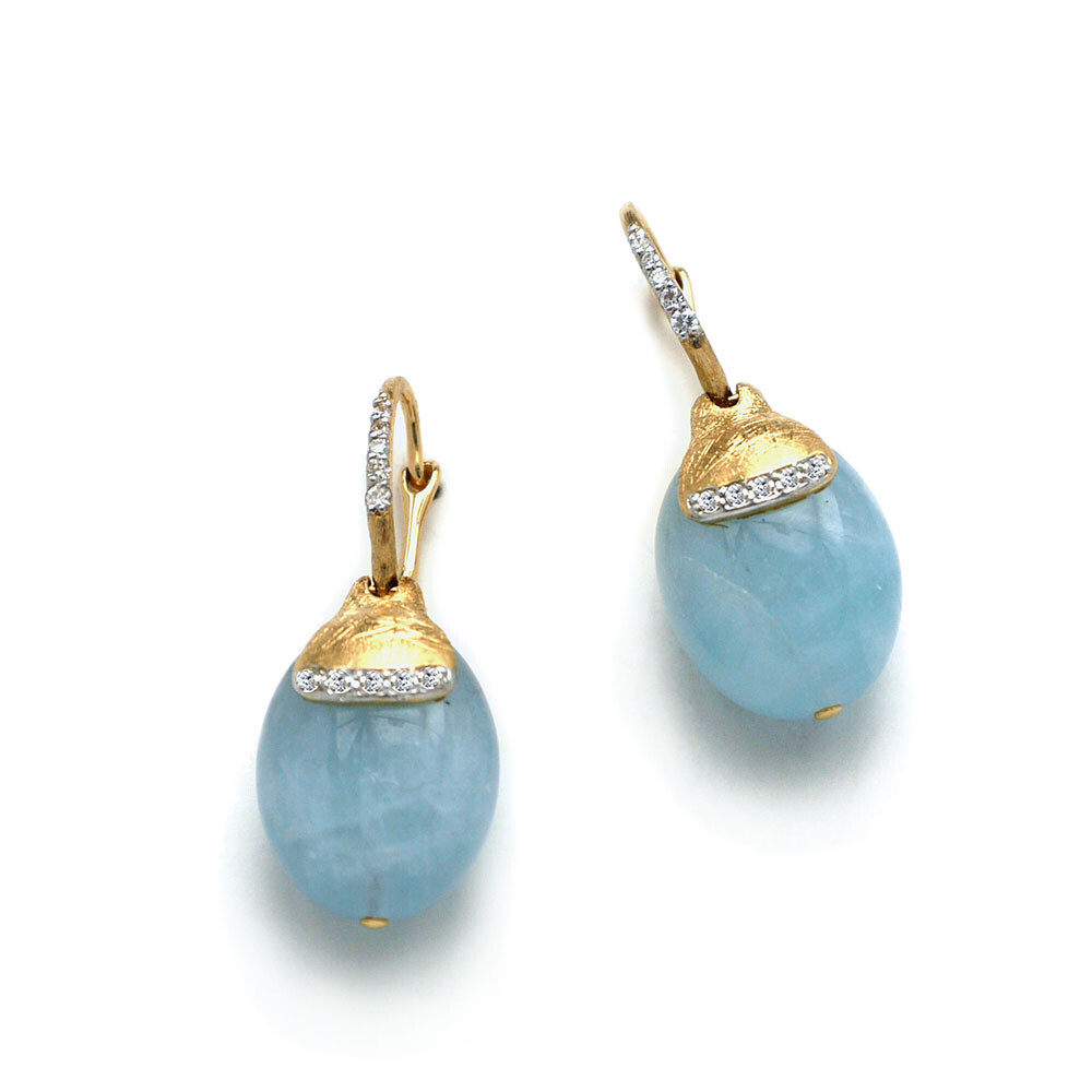 These wondrously dazzling 18K yellow gold drop earrings brought to you by Nanis Fine Jewelry and Italian designer Laura Bicego bring grace and grandeur. They feature an aquamarine bead with engraved gold top set with 0.15 carat white diamond accents and a locking hinged wire back. Dancing In The Rain Aquamarine Drop Earrings
