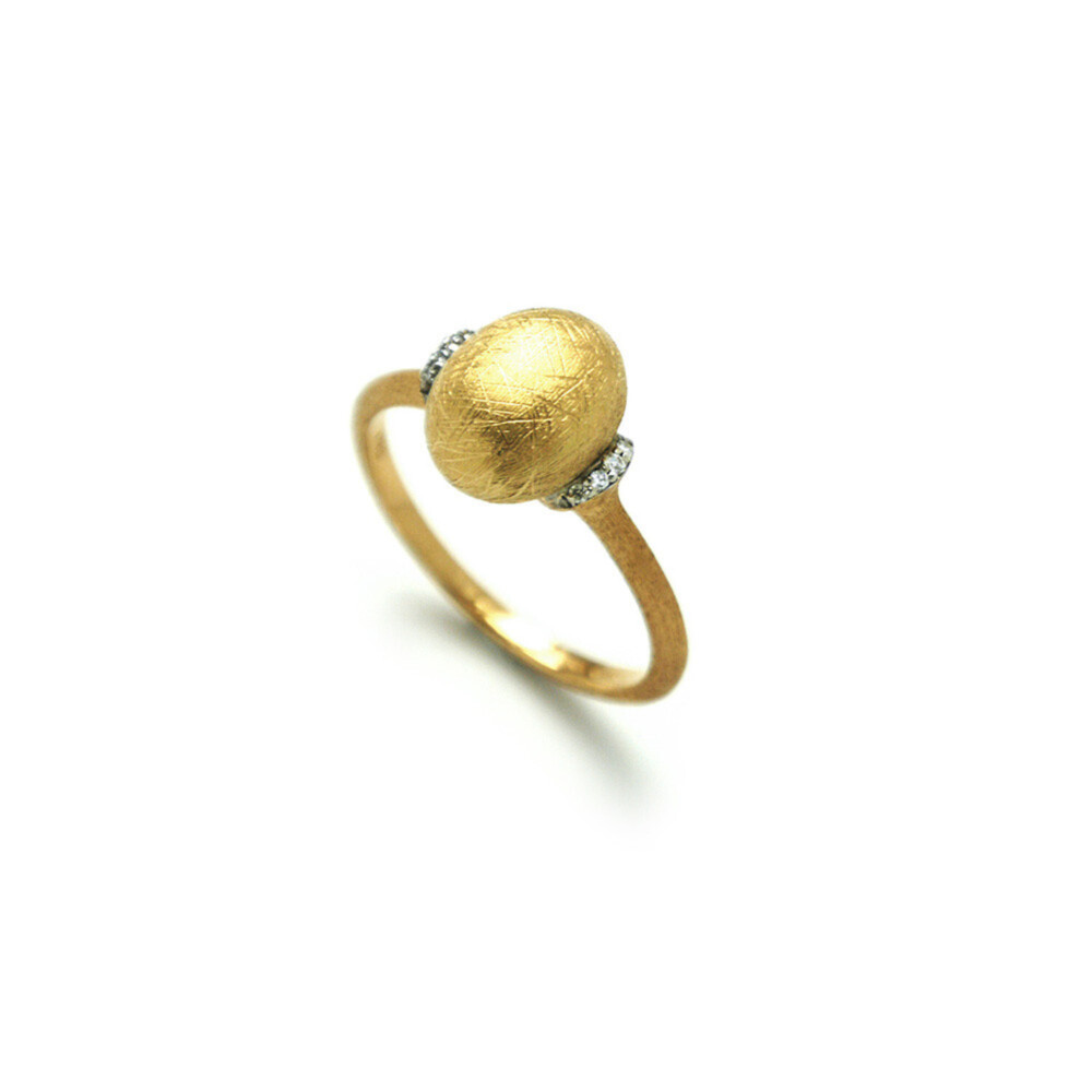 This positively charming 18K yellow gold ring brought to you by Nanis Fine Jewelry and Italian designer Laura Bicego brings genuine nobility. It features a vertical oval Gold pillow at the center with 0.04 carat white diamonds set at the sides of the pillow. Dancing In The Rain Ring