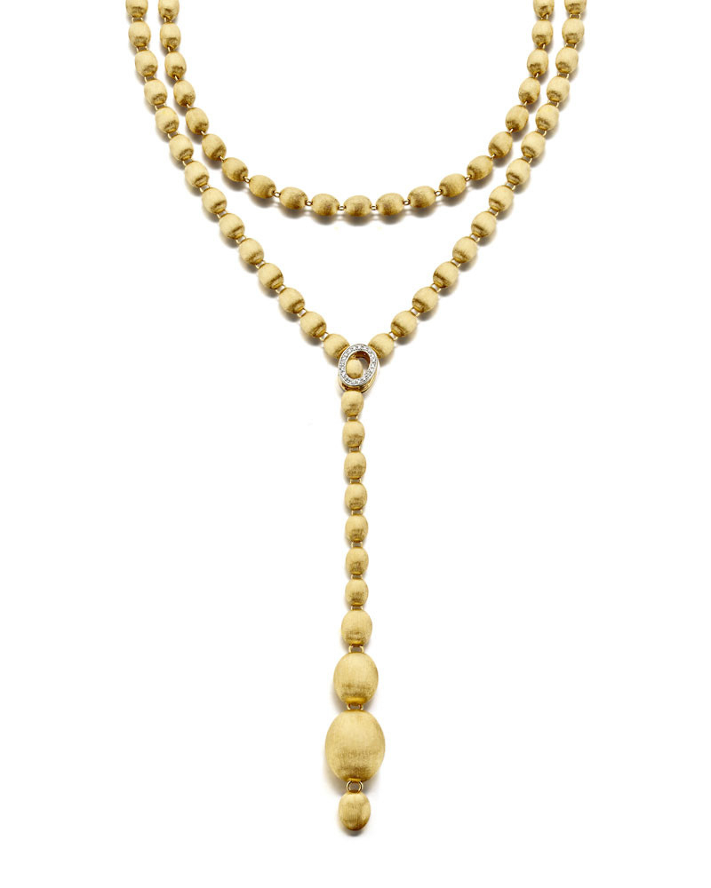 This incredibly lovely 18K yellow gold necklace brought to you by Nanis Fine Jewelry and Italian designer Laura Bicego brings remarkable distinction. It features graduated beads with a 0.23 carat white diamond claw clasp that attaches anywhere along the chain. It may be worn multiple ways. Dancing In The Rain Ivy Necklace