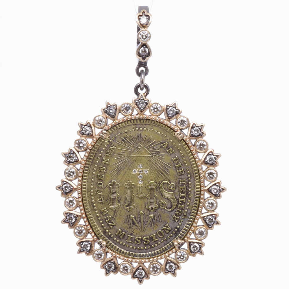 This original German medal has a beautiful depiction of "IHS", a monogram meaning Jesus Christ. The front of the medal is translated to "The sacred mission to remember". The back translates to "Save your soul". The only alteration to the medal is the diamond inlayed cross on the front. The medal is set in a 14k Yellow Gold 7.78g, Diamond 0.90 tcw, and Rhodium sterling bezel. The bale has a 4mm opening. 1930's German IHS Pendant