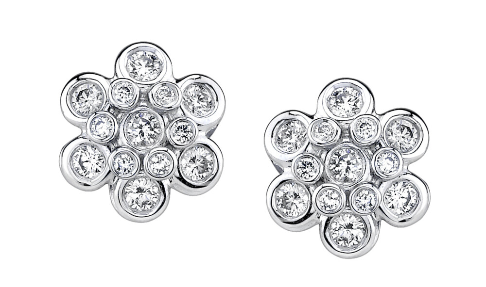 These eye-catching 18K white gold earrings brought to you by Aaron Henry Designs bring heart-stopping elegance. They feature dazzling 1.40 carat domed diamonds. Domed Diamond Earrings