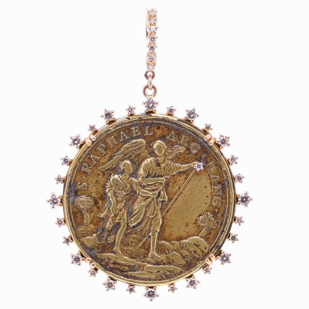 This medal is an original antiquity of Saint Raphael, the Archangel. He is one of the seven archangels who stand before God. Raphael means “God has Healed”. In the Book of Tolbit, Raphael is credited with driving the evil spirit from Sarah and restoring Tobits’s vision, allowing him to see the light of Heaven. Saint Raphael is the patron saint of Travelers, the blind and bodily ills. St. Raphael is reaching up to a diamond that represents a star in Heaven. This medal is set in a unique Cynthia Ann diamond 1.00 tcw, and 14k Yellow Gold 7.60g bezel. It may be clipped onto any necklace. Antique Spanish St. Raphael Archangel