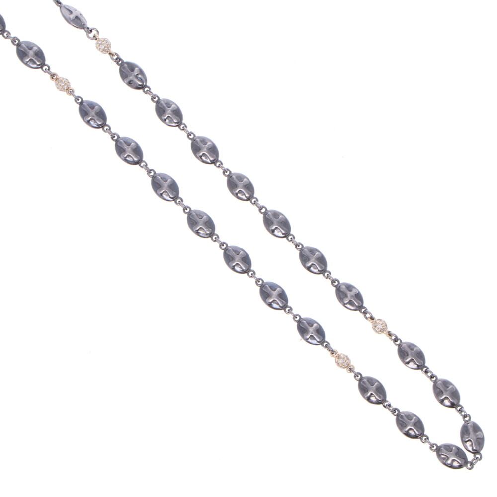 This handcrafted 21" Rhodium Sterling high polish chain has oval shaped shields with a cross engraved on each side. The five 14k Yellow Gold and Diamond 0.45 tcw spheres are placed throughout the chain adding sparkle. This chain can be worn in reverse, hanging your pendant(s) on the jump ring and clasp. The clasp can be upgraded to a diamond clasp (contact for details). Polished Cross Shield Chain With Yellow Gold Diamond Stations 21"