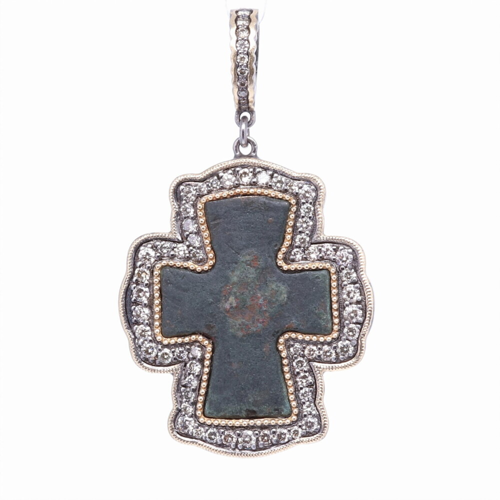 This original Byzantine Cross is defined by it's outwardly widening edges. The Cross has a natural green patina from oxidizing over time. The artifact is set in a 14k Yellow Gold 5.75g, Diamond 1.37 tcw, and Rhodium Sterling. The bale has a 4mm opening. Byzantine Artifact Cross Pendant