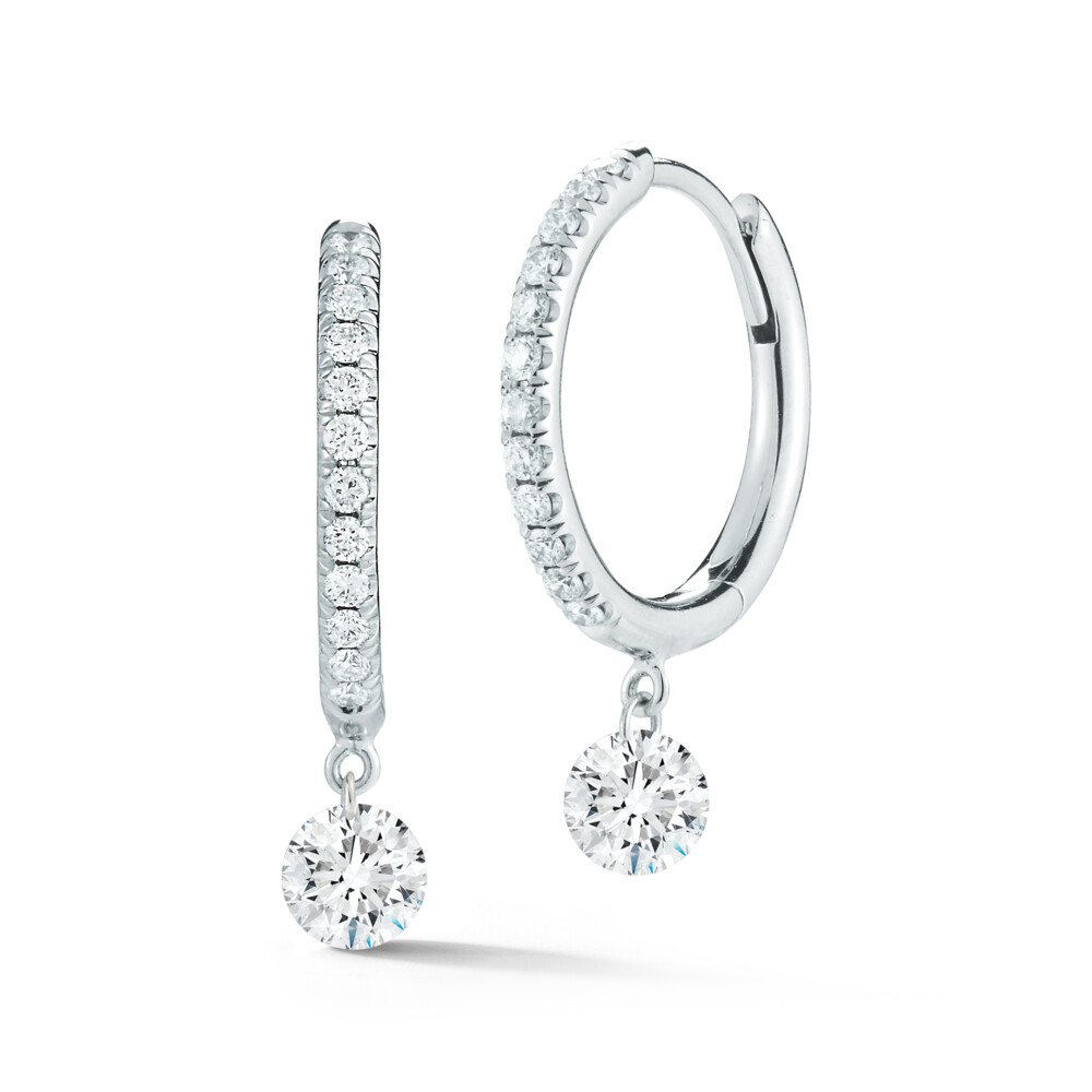 These truly dazzling 18K white gold earrings brought to you by Willow Diamonds and designer Jacquie Earle bring modern elegance. They feature a pave hoop design and 0.30 carat dangle diamonds. Dangle Pave Hoops Diamond Earrings