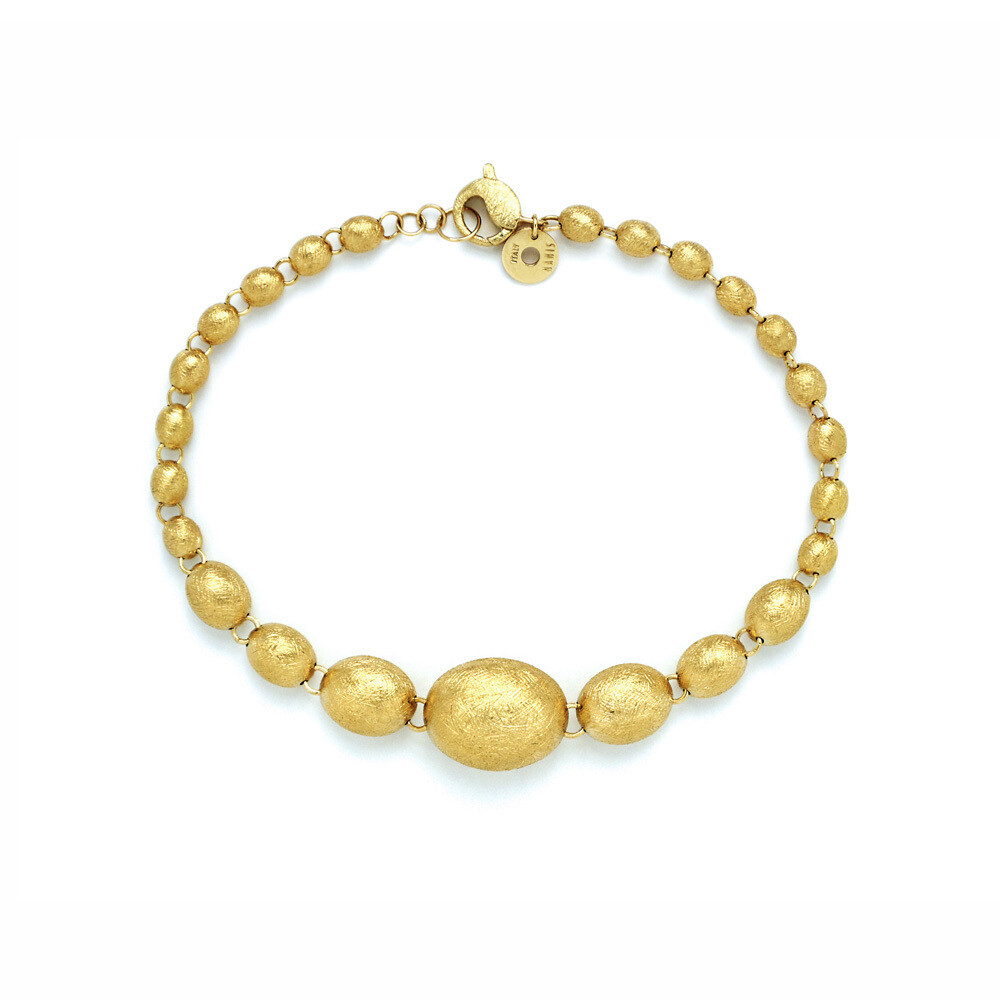 This beautifully bold 18K yellow gold ebb bracelet brought to you by Nanis Fine Jewelry and Italian designer Laura Bicego brings sheer luxury. It features a simple engraved graduated bead design. Dancing In The Rain Ebb Graduated Bead Bracelet